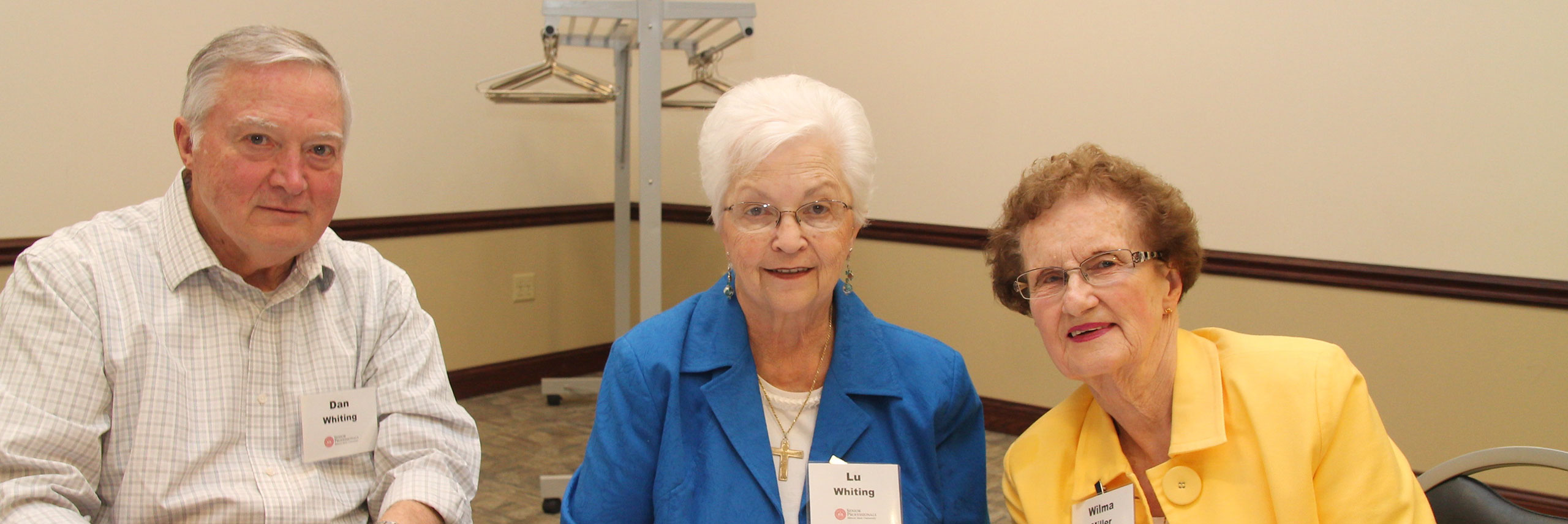 Senior members posing on a Illinois State event.